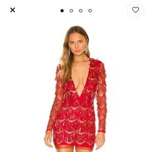 Red sequin mini dress. Never worn with tags. Beautiful dress but a little small.
